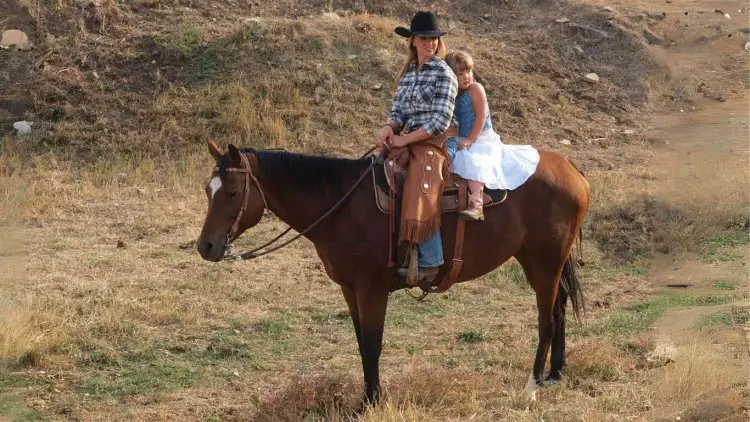 Double riding on horse on one saddle